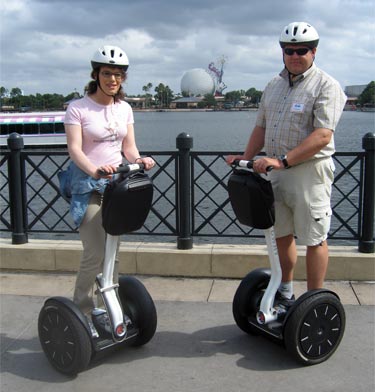 On Segways in the World Showcase area with the EPCOT ball in the background